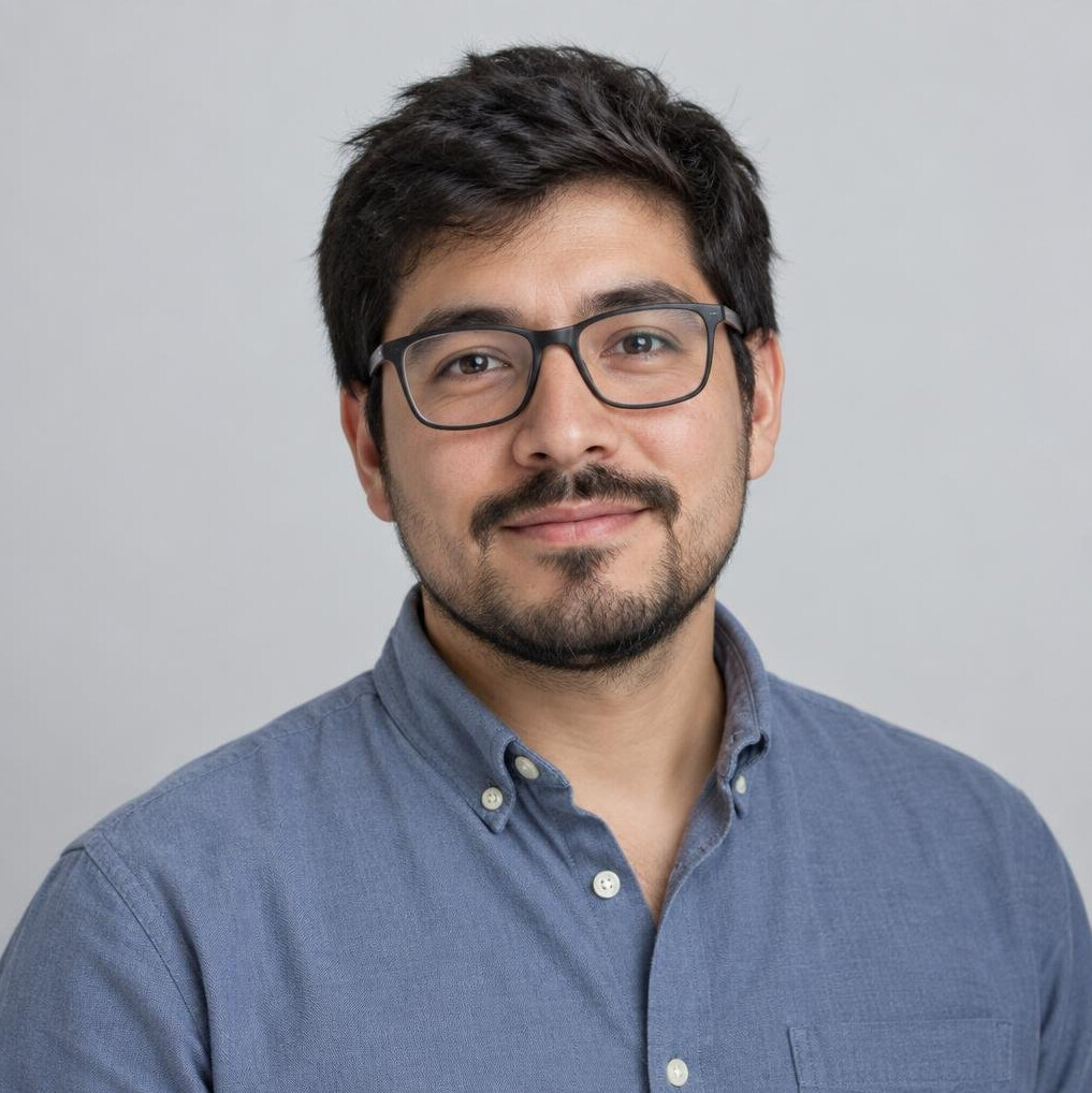 Studio portrait of a young Chilean man with glasses and a beard